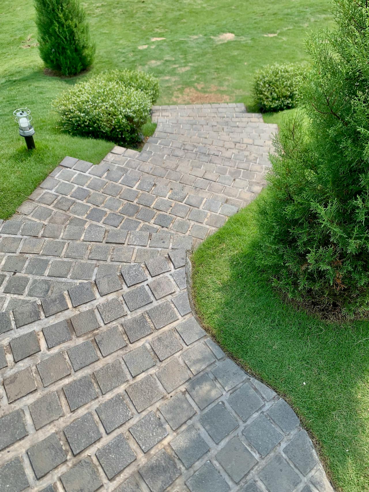 Custom hardscaping in Perth WA — natural stone patios, retaining walls, driveways and outdoor kitchens built to last